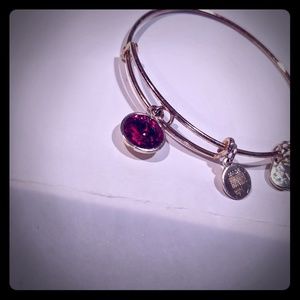 Gold Alex and Ani bracelet with Ruby birthstone